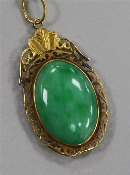 A Chinese gold framed jade pendant, in a Tessier box